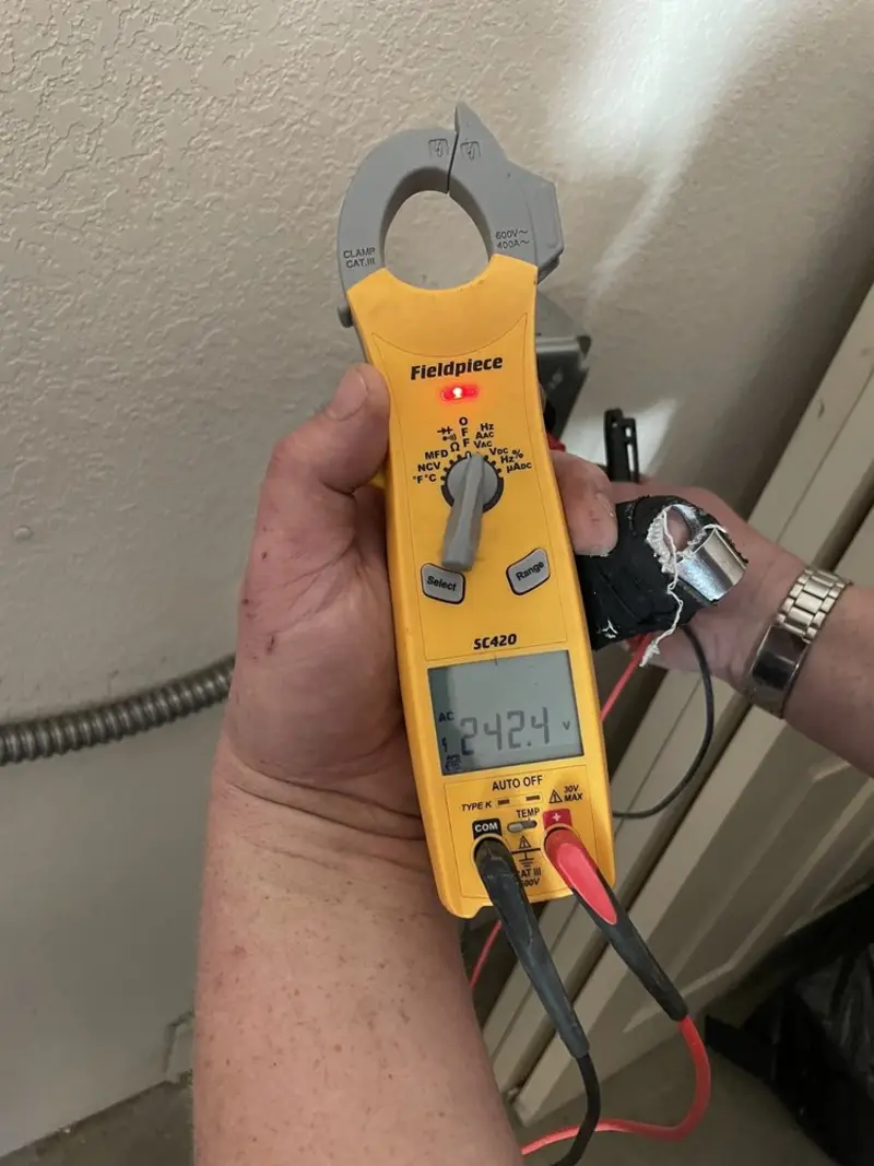 Voltage testing with clamp meter during Ceiling Fan Installation in Saugerties